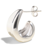 Packshot of a chunky silver hoop earring with a smooth, polished finish, perfect for a bold fashion statement.