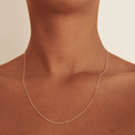 Thin gold necklace chain on brown skin in 18inch