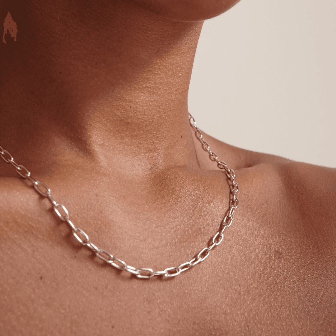 Silver chain necklace on brown skin