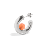 a silver hoop earring with a orange tangerine quartz gemstone positioned inside the open hoop