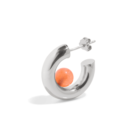 a silver hoop earring with a orange tangerine quartz gemstone positioned inside the open hoop