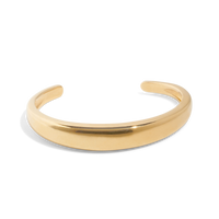 Gold cuff bracelet on packshot, also known as a gold bangle bracelet