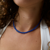 Neck with a blue quartz gemstone necklace