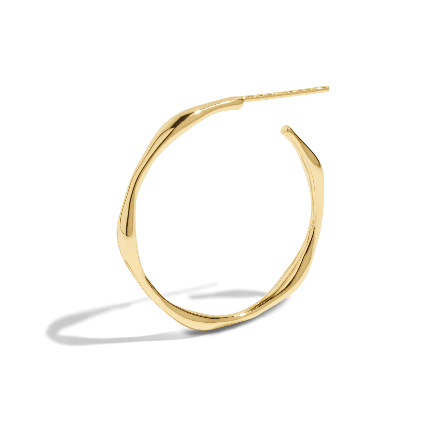 Gold hoop earring with a twisted, asymmetrical design, adding a modern touch to a classic style. This packshot highlights the unique shape and polished finish.