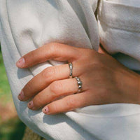 a close up of a person holding a pair of scissors 