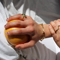 a close up of a person holding a hot dog 