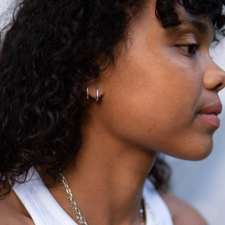 a close up of a person holding a cell phone 