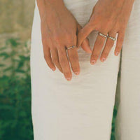 a close up of a person holding a pair of scissors 