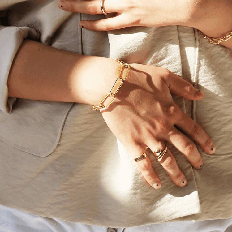 a close up of a person holding a pair of scissors 