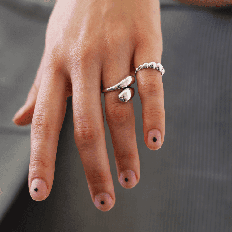 a close up of a person holding a pair of scissors 