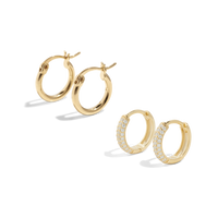 Packshot of our gold hoop earrings set. Also known as huggie hoops gold.