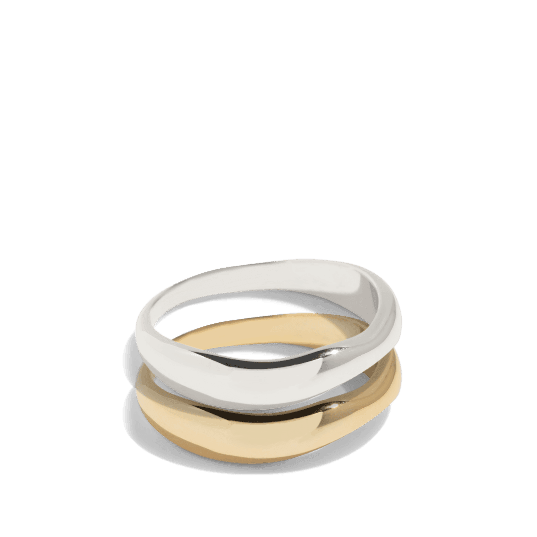 Set of two rings in gold and silver with smooth, irregular bands, offering a modern twist on classic styles. This packshot showcases the minimalist and versatile design, perfect for stacking or wearing individually.